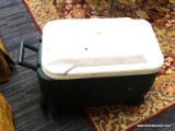 IGLOO WHEELIE COOLER; DARK GREEN WITH A WHITE LID FEATURES DOUBLE, DROP-DOWN HANDLES FOR EASY