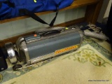 VINTAGE ELECTROLUX VACUUM; FEATURES A BLUE EXTERIOR WITH A FLEXIBLE HOSE AND SWEEPER WAND CONNECTOR.