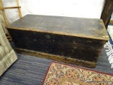 STORAGE CHEST; PAINTED BLACK AND FEATURES A DISTRESSED LOOK. WOULD BE A WONDERFUL RESTORATION PIECE