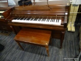 WURLITZER UPRIGHT PIANO; FEATURES A BEAUTIFUL CHERRY FINISH, A SLIDING KEYBOARD COVER, AND A STORAGE