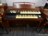 LOWREY ELECTRIC ORGAN; CHERRY FRAME ELECTRIC ORGAN. MODEL LSL. SERIAL NUMBER 506573. MEASURES 44.5