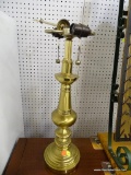 BRASS TABLE LAMP; FEATURES A ROUND, BEVELED BASE WITH A TURNED STYLE BODY. FEATURES DOUBLE BULBS,