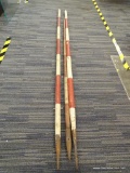 LOT OF 3 WOODEN JAVELINS; HAND PAINTED WITH RED AND WHITE STRIPES. CONDITION IS CONSISTENT WITH AGE.