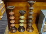 LOT OF WOODEN CANDLE HOLDERS; SET OF 3 MATCHING CANDLE HOLDERS. STAGGERED DESIGN WITH BELL SHAPED