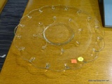 ROUND VINTAGE GLASS PLATTER; CLEAR GLASS WITH RAISED TEAR DROP DESIGN ON THE BOTTOM. PLATTER HAS