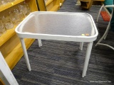 PATIO END TABLE; GLASS TOP AND WHITE METAL WITH CURVED LEGS THAT COME TO A STRAIGHT FINISH. IS IN