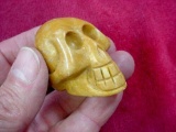 Hand Carved Amber Colored Stone or Marble Stylized Skull Head . Interesting small stone or marble