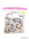 BAG OF ASSORTED PEARLS; BAG CONTAINS SEVERAL STRANDS OF ASSORTED PEARLS IN ALL IMAGINABLE COLORS.