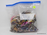 BAG LOT OF COSTUME JEWELRY; BAG LOT CONTAINING ASSORTED BRACELETS, NECKLACES, AND PINS.
