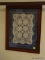 (UPBR1) FRAMED ITEM; FRAMED AND MATTED DOILY WITH BLUE BACKGROUND AND IN A MAHOGANY FRAME. MEASURES