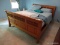 (UPBR2) SLEIGH BED; PINE FULL SIZE BED WITH WOODEN RAILS. IS IN VERY GOOD CONDITION AND MEASURES 66