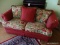 (FAM) SOFA; 2 CUSHION RED STRIPED UPHOLSTERED SOFA IN GOOD USED CONDITION. HAS A FLORAL UPHOLSTERED