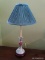 (FAM) PORCELAIN LAMP; ROSE PATTERN TABLE LAMP WITH GREEN SHADE. IS IN VERY GOOD CONDITION AND
