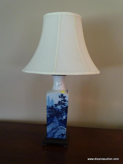 (LR) ORIENTAL BLUE AND WHITE LAMP; HAS A CLOTH BELL SHAPED SHADE WITH FINIAL AND HAS AN IMAGE OF A