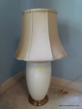 (UPBR2) PORCELAIN LAMP; WHITE PORCELAIN AND BRASS LAMP WITH SHADE AND FINIAL. MEASURES 30 IN TALL