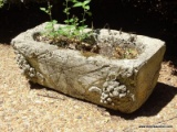 (OUT) CONCRETE PLANTER; HAS A GRAPE PATTERN. 24 IN X 10 IN X 9 IN