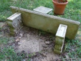 (OUT) CONCRETE BENCH; HAS SWIRL DESIGN LEGS AND MEASURES 57 IN X 20 IN X 19 IN