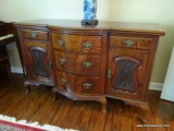 (LR) EUROPEAN MAHOGANY AND BURLED SIDEBOARD; HAS 2 CARVED PANELED DOORS, 5 DOVETAIL DRAWERS WITH