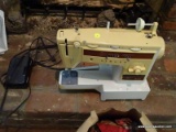 (FAM) SINGER SEWING MACHINE; MODEL STYLIST 833. IS IN GOOD CONDITION AND INCLUDES A UKROPS PAPER BAG