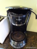(KIT) COFFEE MAKER; MADE BY MR. COFFEE AND HAS A 12 CUP BREWING CAPACITY. IS PROGRAMMABLE AND IS IN