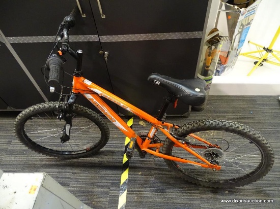 NISHIKI MOUNTAIN BIKE; ORANGE IN COLOR. IS A SEVEN SPEED MEN'S BIKE WITH ADJUSTABLE FRICTION. HAS A