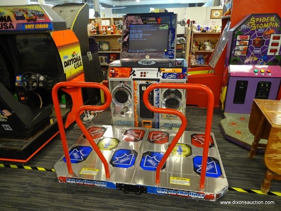 ANDAMIRO "PUMP IT UP" DANCE ARCADE GAME; MODEL #AM02-PUGKA, SERIAL #GPUSBC08030006. THIS IS A