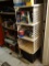 STORAGE SHELF; WHITE 4 SHELF STORAGE UNIT WITH SEE THROUGH SHELVES. MEASURES 17 IN X 15 IN X 36 IN