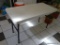 LIFETIME 4 FT FOLDING TABLE; RECTANGULAR CREAM COLORED TOP WITH BLACK METAL LEGS. MEASURES 4FT X 5