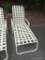 OUTDOOR WHITE ALUMINUM & VINYL CROSS STRAP CHAISE LOUNGE; ADJUSTABLE BACK. IN GOOD USED CONDITION.