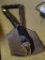 TRENCH STYLE SHOVEL; HAS A BLACK METAL HANDLE AND FOLDING SHOVEL HEAD. IS IN GOOD CONDITION.