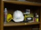 SHELF LOT; INCLUDES INCLUDES RUST-OLEUM, A RECESSED LIGHTING FIXTURE, AN AFLAC HARD HAT, ETC.