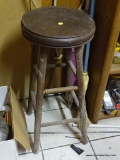 WOODEN STOOL; HAS A BROWN UPHOLSTERED SEAT AND MEASURES 13 IN X 30 IN