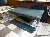 LIFETIME FOLDING PICNIC TABLE; CHILD'S PICNIC TABLE WITH RECTANGULAR GREEN COLORED TOP SITTING ON