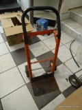 FOUR WHEEL HAND TRUCK; ORANGE AND BLACK 4 WHEELED HAND TRUCK WITH ADJUSTABLE HANDLE. DOES SHOW SOME