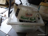 BAG OF PLANT FOOD; CLEAR PLASTIC TOTE WITH A PARTIALLY USED BAG OF WEAVER LAWN & GARDEN PLANT FOOD.