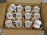 MANIKIN INSURANCE CENTER MUGS; BOX FULL OF MANIKIN COFFEE MUGS.