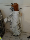 SET OF RIGHT-HANDED WILSON STAFF GOLF CLUBS; SET COMES IN PERSONALIZED WHITE LEATHER GOLF BAG.