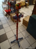 PARTY CLOWN COAT HANGER; THREE CLOWN HOOKS, 49 IN TALL, RAINBOW COLORED.