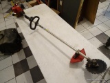 HOMELITE TRIMMER; GAS POWERED TRIMMER WITH AN ABRASIVE CUTTING WHEEL ATTACHMENT. HAS NOT BEEN