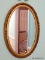 (HALL) OVAL FRAMED MIRROR; GOLD TONED FRAME MIRROR IN EXCELLENT CONDITION. MEASURES 1 FT 6 IN X 2 FT