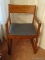 (BR1) ARM CHAIR; OAK ARM CHAIR WITH VINYL UPHOLSTERED SEAT. IS IN EXCELLENT CONDITION AND MEASURES 1