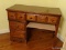 (MBR) SINGLE PEDESTAL DESK; PINE DESK WITH 4 DRAWERS AND BRASS PULLS. IS IN GOOD USED CONDITION AND