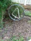 (OUT) SPRINKLER STAND; HAS A TRIANGULAR SPINNING CENTER AND HAS A CIRCULAR OUTER RIM. MEASURES 3 FT