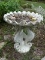 (OUT) BIRD BATH; SEAHORSE THEMED BIRD BATH WITH SCALLOPED EDGE BASIN. MEASURES 2 FT 3 IN X 2 FT 8 IN