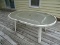 (OUT) PATIO TABLE- PATIO TABLE WITH PLEXIGLAS TOP- 38.5 IN X 60 IN X 27 IN