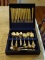 (DR) FLATWARE IN CASE; 84 PCS OF INTERNATIONAL GOLD TONED STAINLESS STEEL FLATWARE IN FLORAL PATTERN