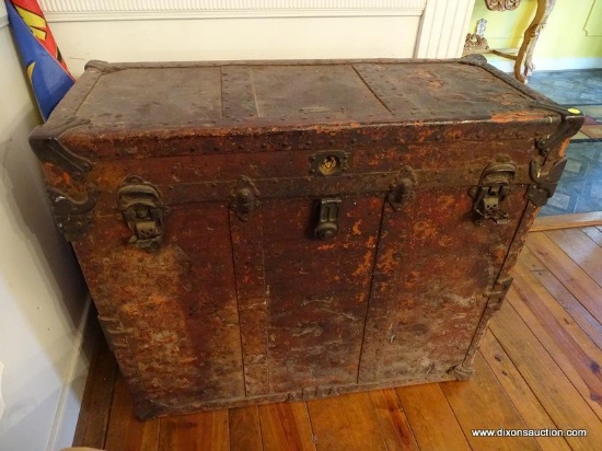 (LR) UNUSUAL TALL TRUNK; TALL DOUBLE HANDLED LEATHER AND WOODEN TRUNK WITH CONTENTS. IS IN GOOD