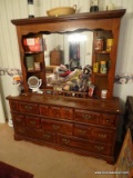 (BR1) MIRRORED DRESSER; PINE 8 DRAWER DRESSER WITH MIRRORED BACK AND 4 SHELVES WITH GALLERY ON THE