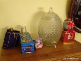 (DR) MISC.. ITEMS ON TOP OF CHEST; MISC. ITEMS INCLUDE A LIDDED GLASS TEA DISPENSER, CROWN ROYAL