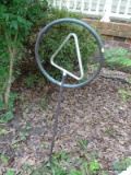 (OUT) SPRINKLER STAND; HAS A TRIANGULAR SPINNING CENTER AND HAS A CIRCULAR OUTER RIM. MEASURES 3 FT